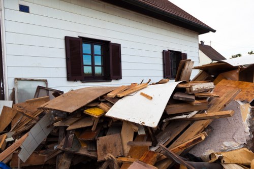 Residents arranging furniture for disposal in Thamesmead